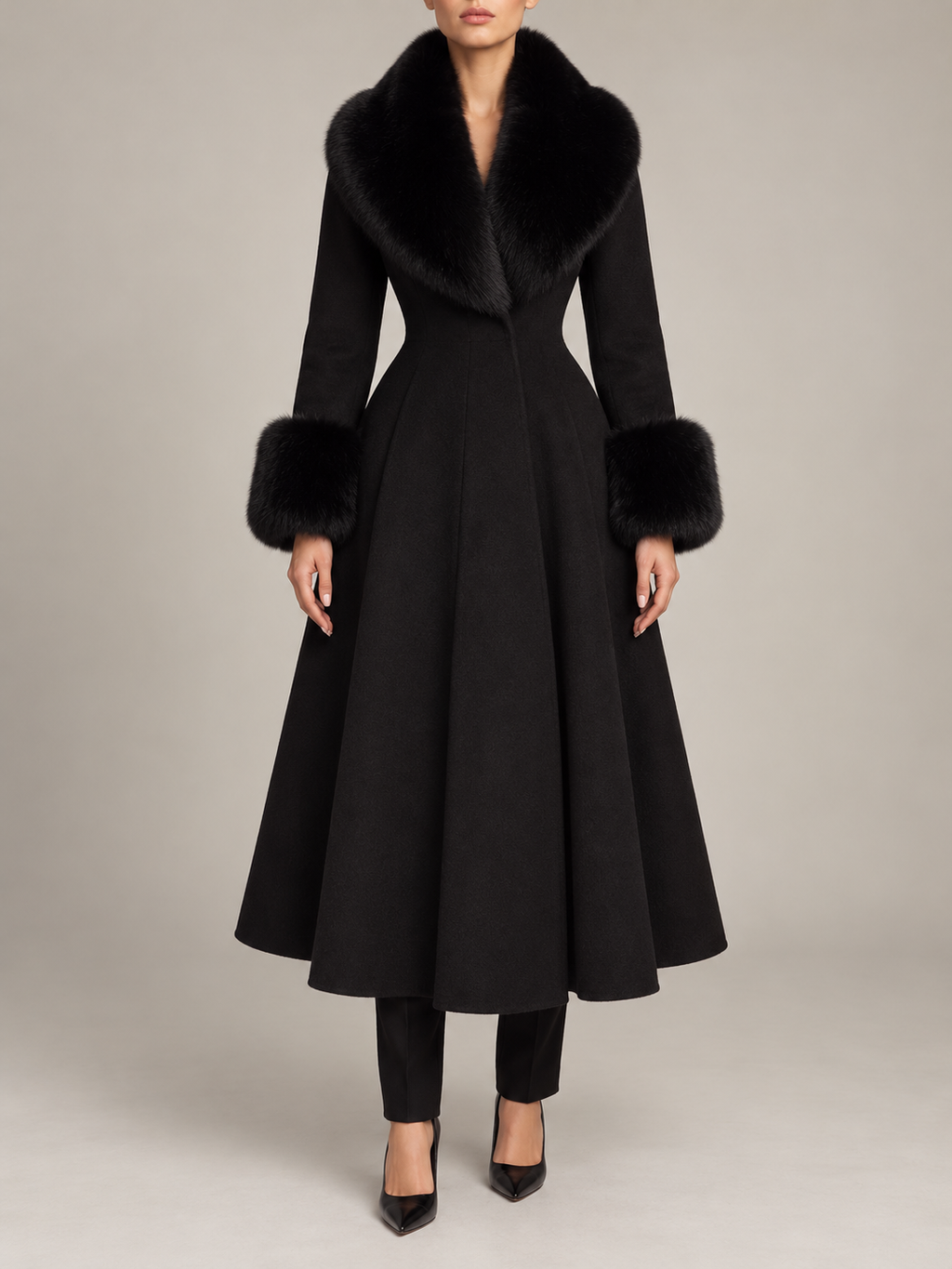 black calf-length A-line coat with full skirt, fitted waist, black faux-fur collar and cuffs, front view on a model