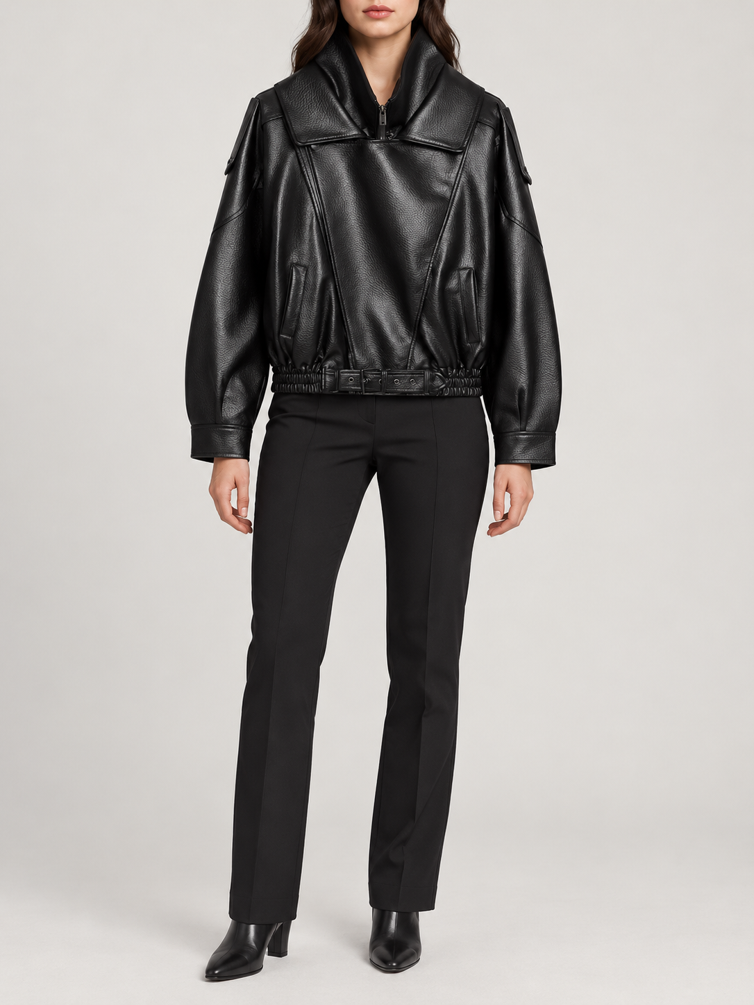 black leather-look cropped biker jacket with high fold collar and asymmetric front, front view on a model