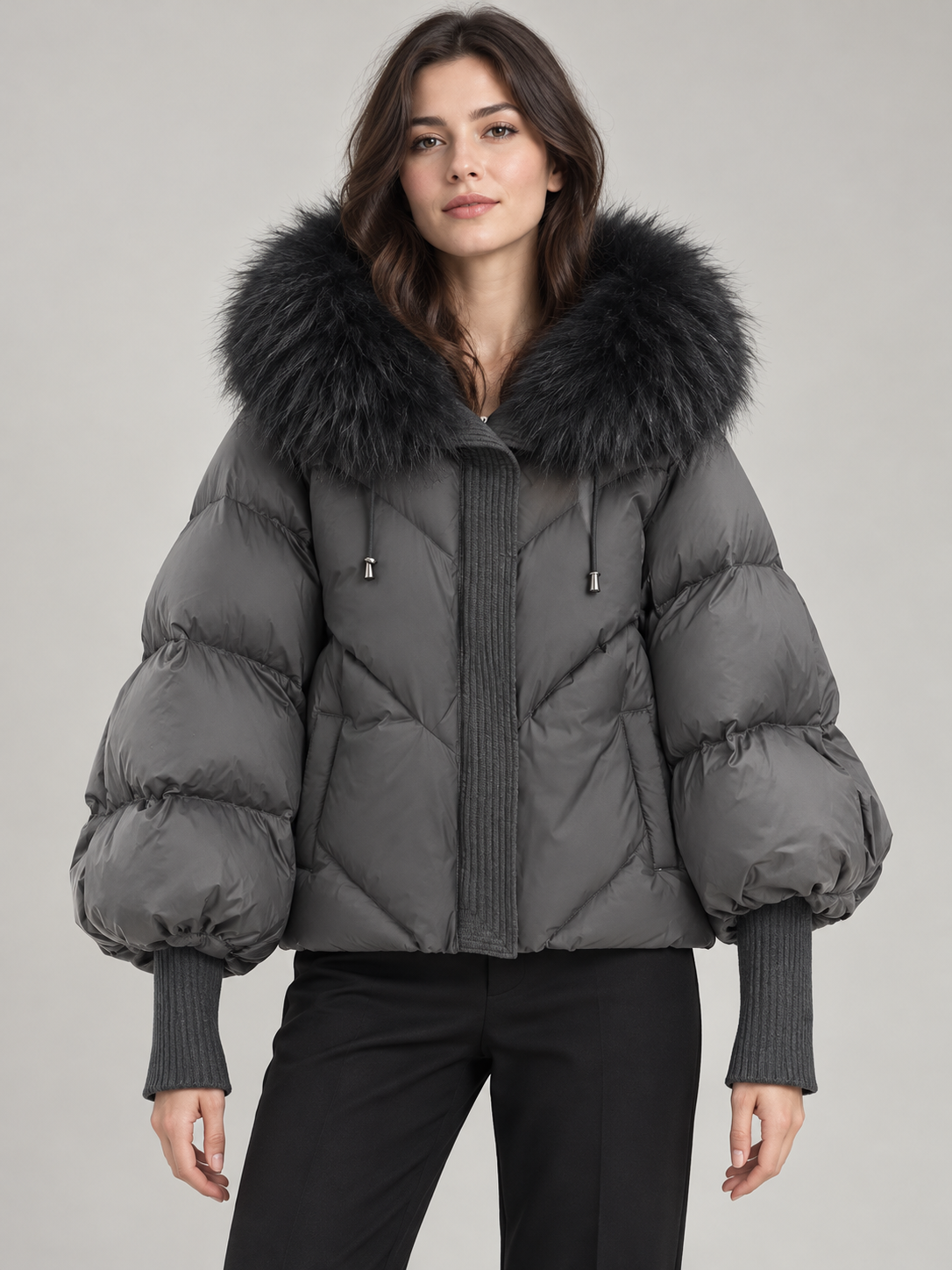 Grey puffer with black faux-fur hood trim, front view