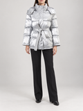 silver glossy quilted hooded puffer jacket with self-tie waist belt and horizontal panels, front view on a model