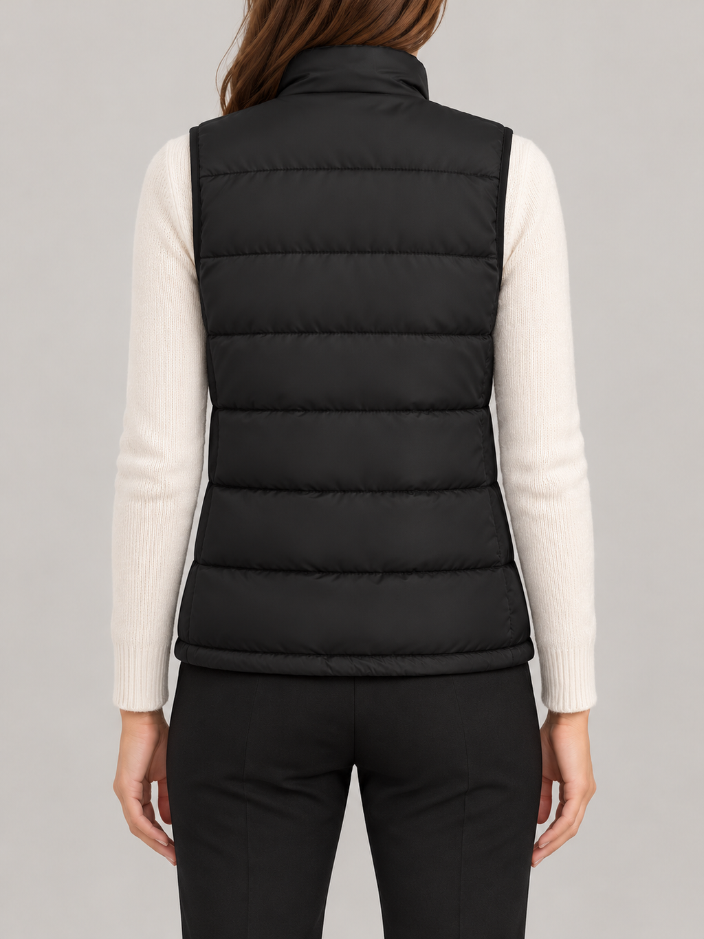 black quilted heated vest with small dual chest control, back view