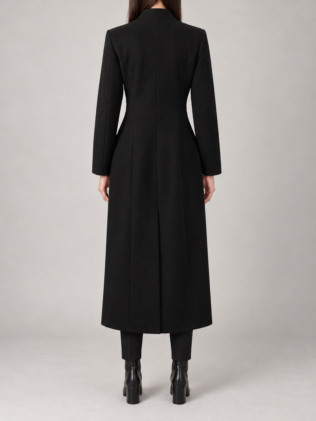 Black long tailored coat on a model, back view