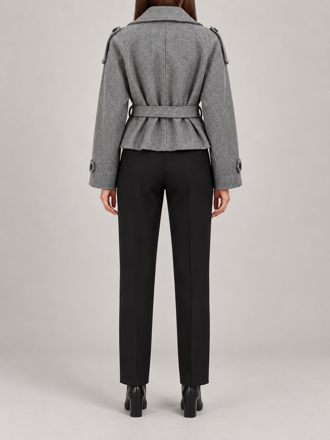 Grey cropped belted jacket on a model, back view