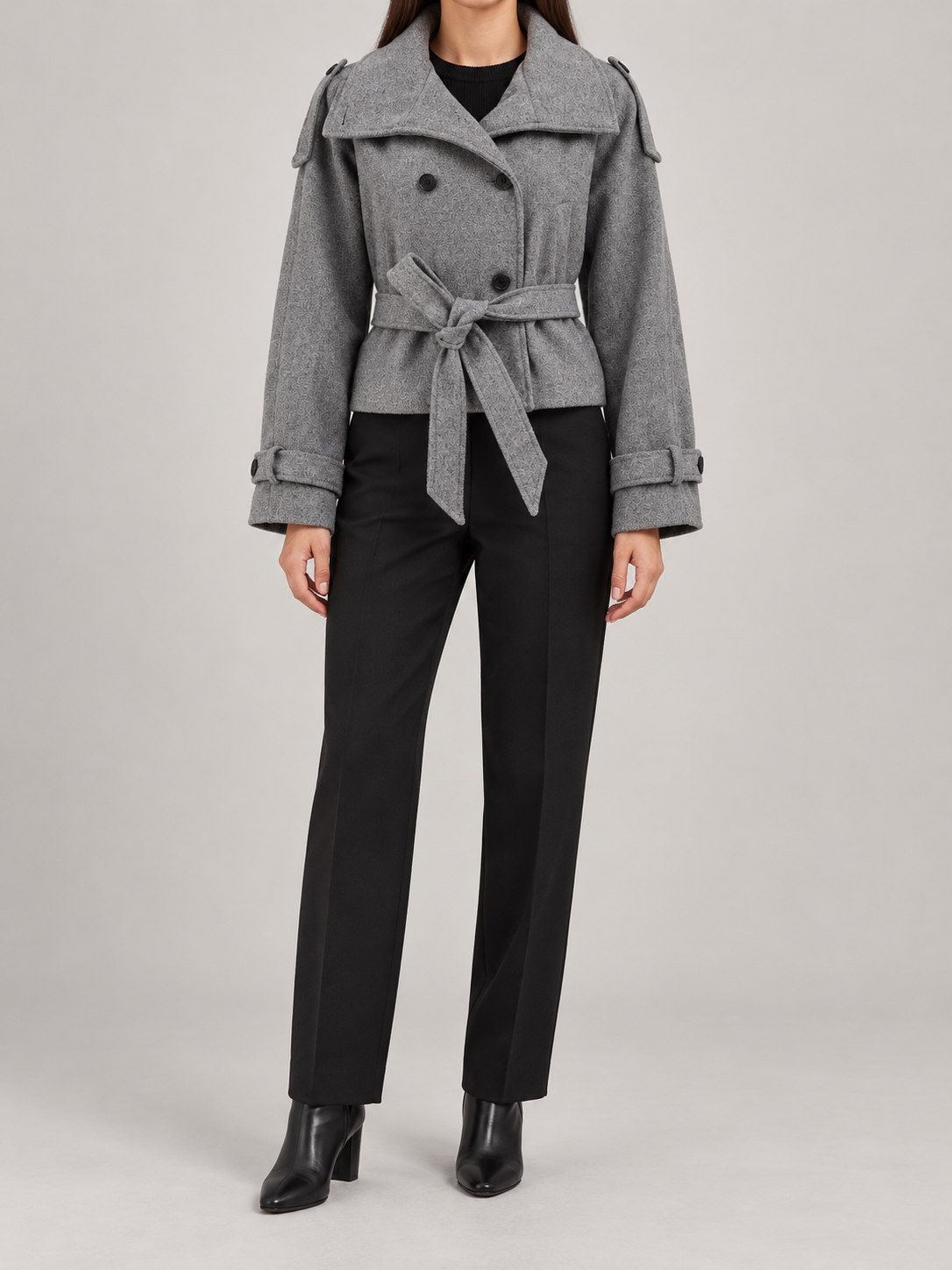 Grey cropped belted jacket on a model, front view