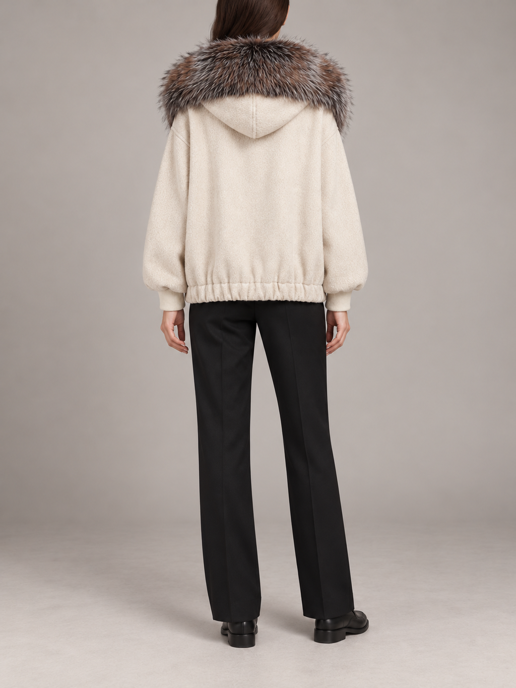 ivory relaxed hooded jacket with multitone brown-grey faux-fur collar trim, gathered hem and patch pockets, back view on a model