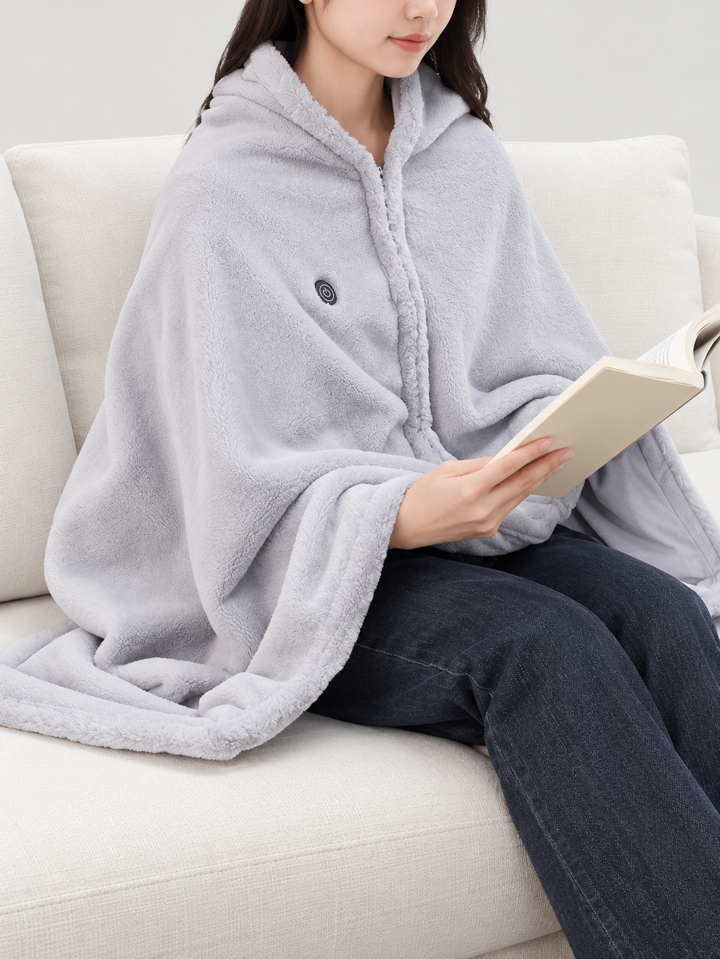 light grey plush zip-front heated throw worn over shoulders, front view