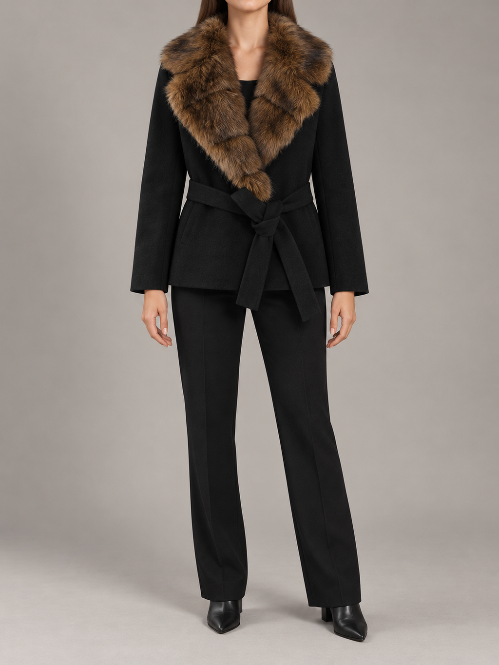 black short belted coat with brown segmented faux-fur shawl collar, straight sleeves and fabric waist tie, front view on a model