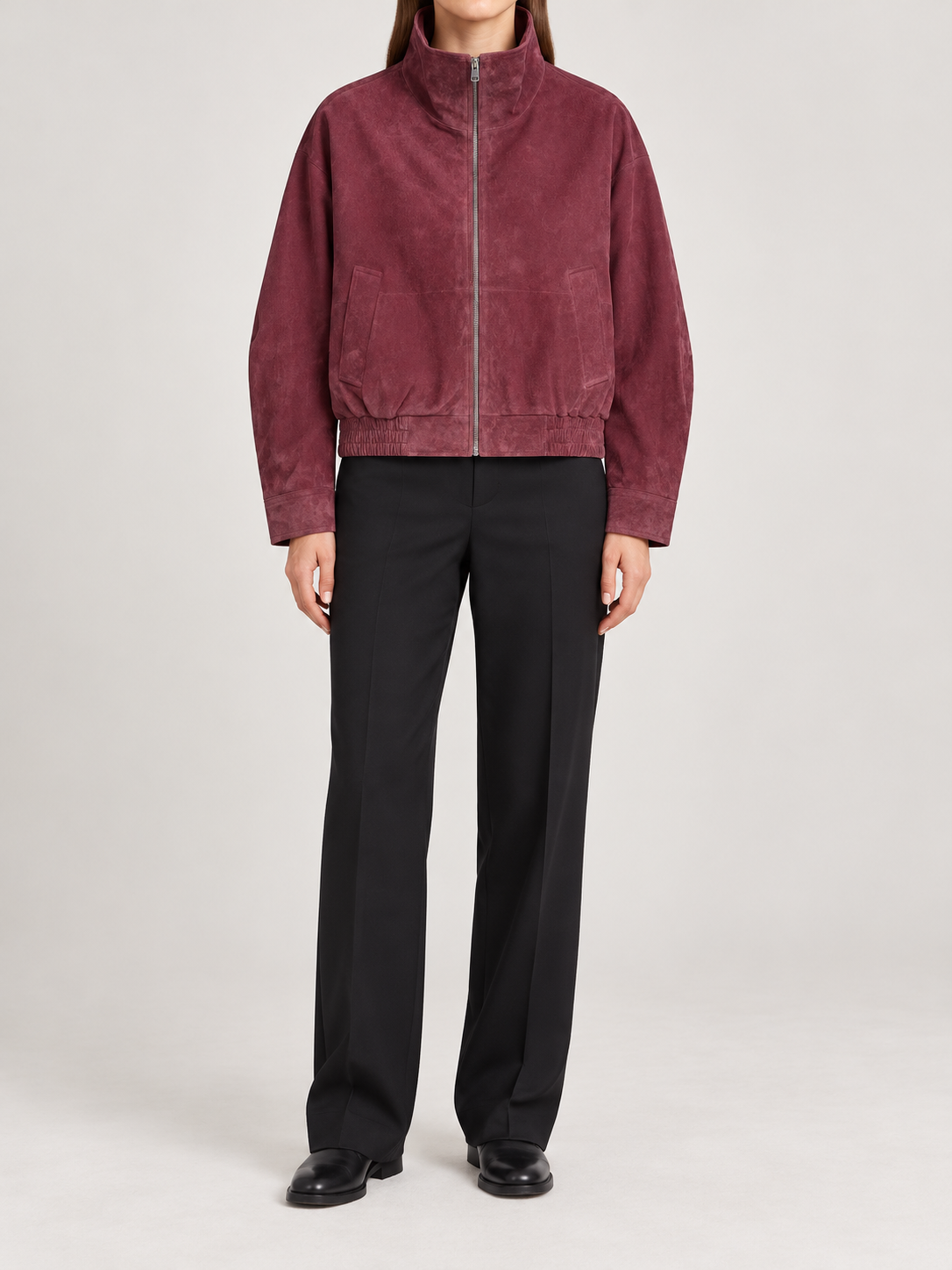 wine burgundy suede-touch stand collar zip-front short jacket with elasticated hem, front view on a model