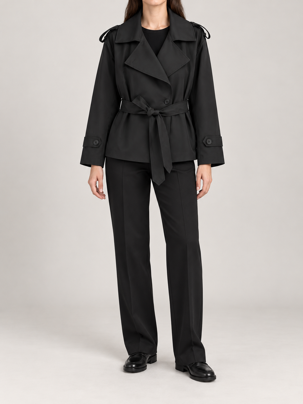black short belted wrap trench, front view on a model