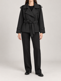 black short belted wrap trench, front view on a model