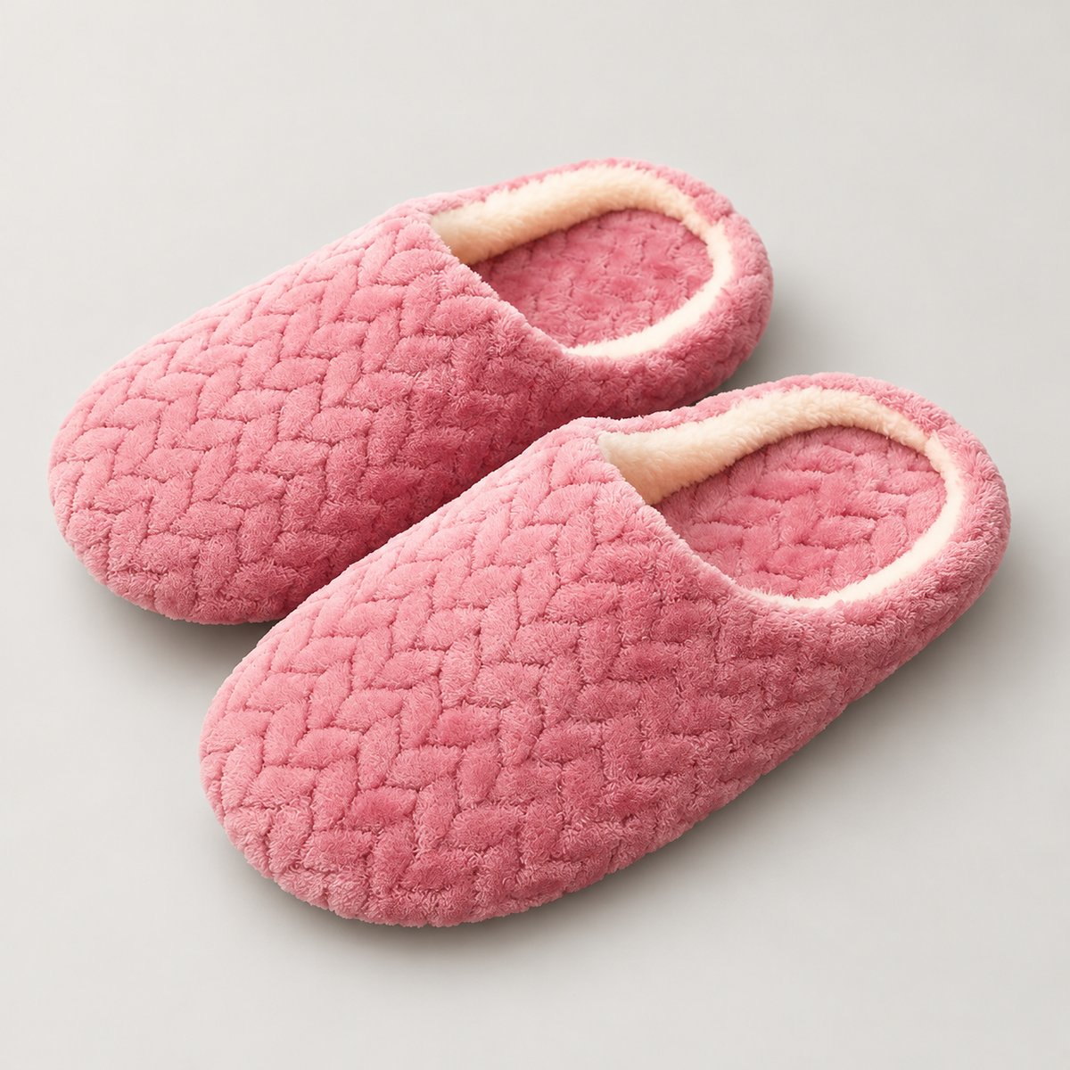 pink textured fleece cloud slippers with cream lining, front view