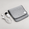 grey quilted heated comfort pad with white wired controller, front view