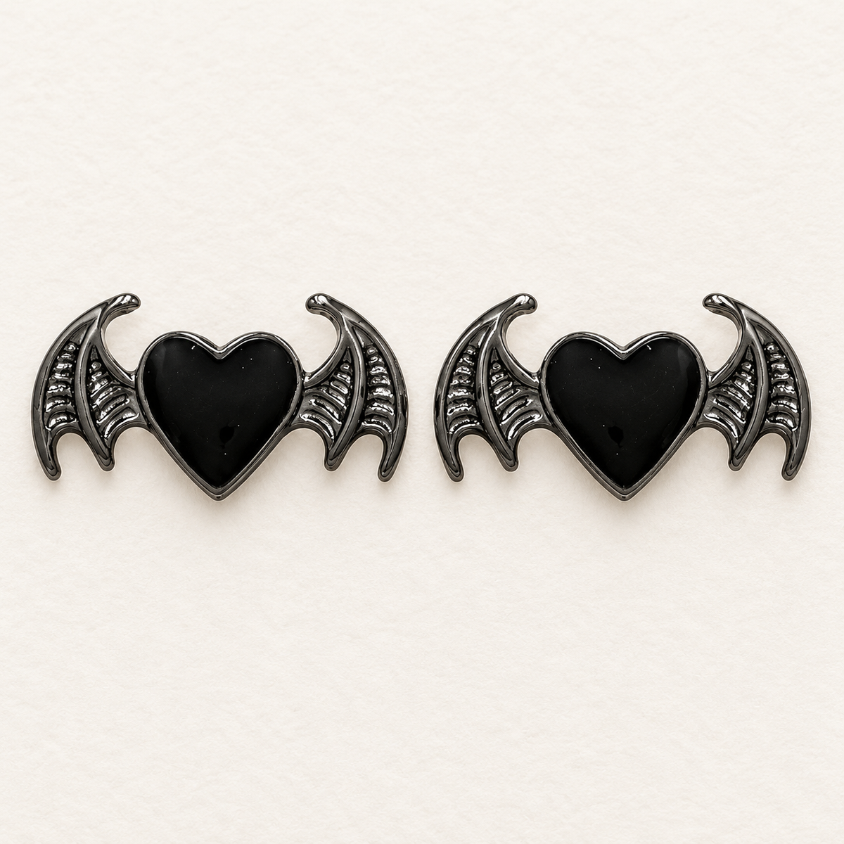 AI-assisted detail of the bat-heart pair included in the three-pair Halloween earring set