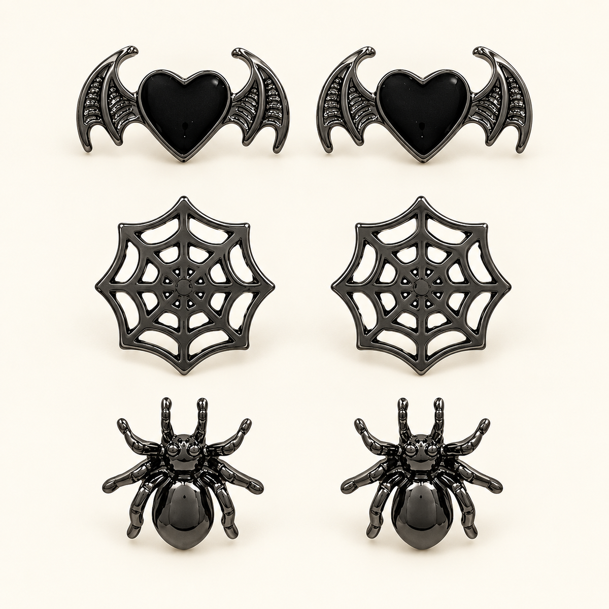 AI-styled studio photograph of the exact Halloween Earrings — 3-Pair Spider, Web & Bat Set; front view.