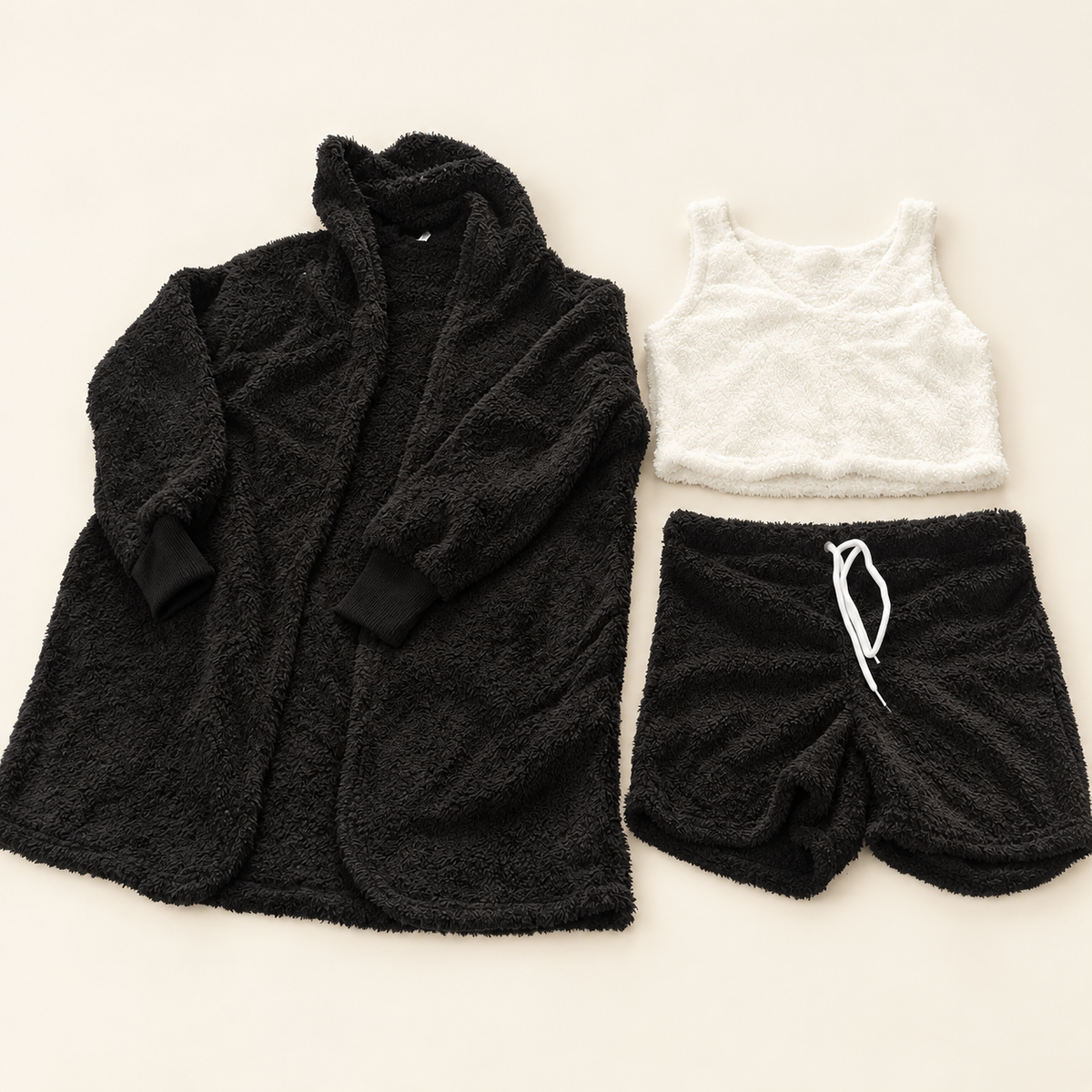 Black cardigan, white cropped tank and white-drawstring shorts